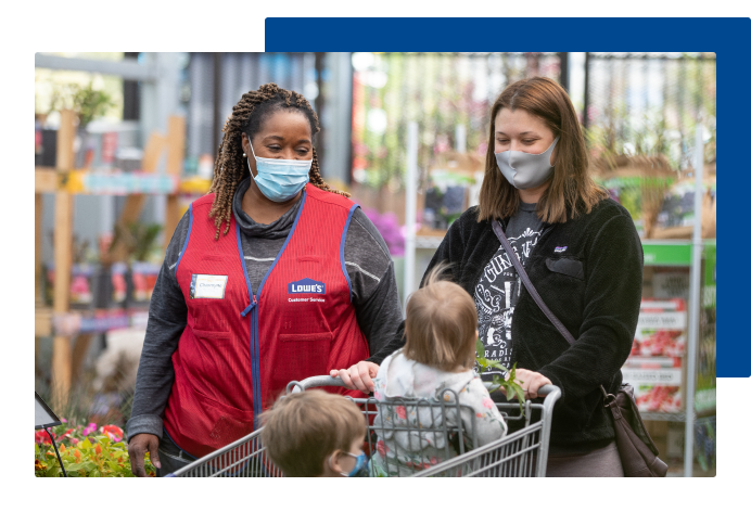 Lowe's associate in garden department talking with customer