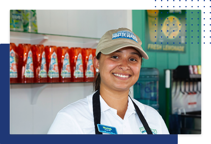 Woman working at food service counter and smiling