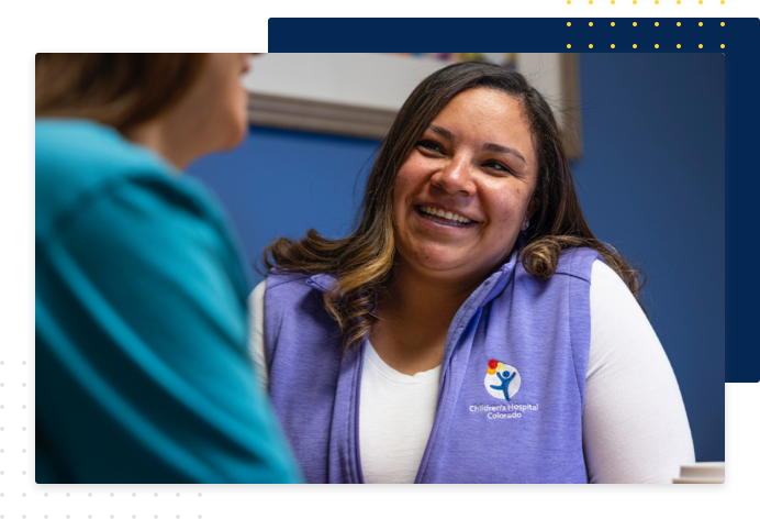 Employee speaking with patient
