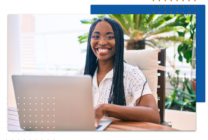 Student smiling on her laptop